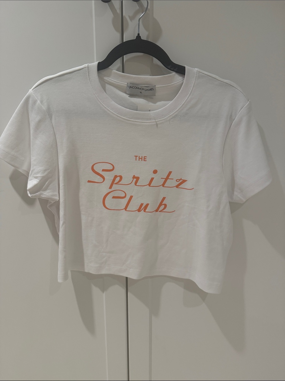 Uncommon James White Crop Tee with Coral Script
